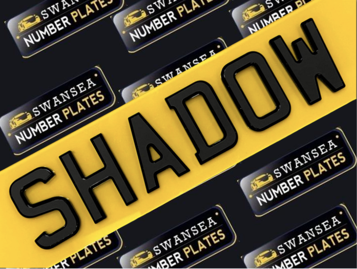 Close-up of sleek 4D number plates with a raised, dimensional effect on a stylish vehicle, showcasing the latest trend in custom plate design.